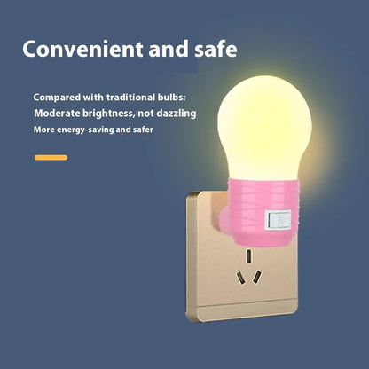 Plug-in bedside baby night light in white, blue, or pink shell with round shape.
