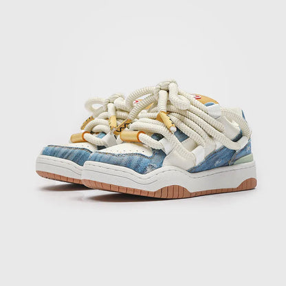Low-top unisex casual shoes in denim blue with a round toe, thick rubber sole, and front lace-up closure.