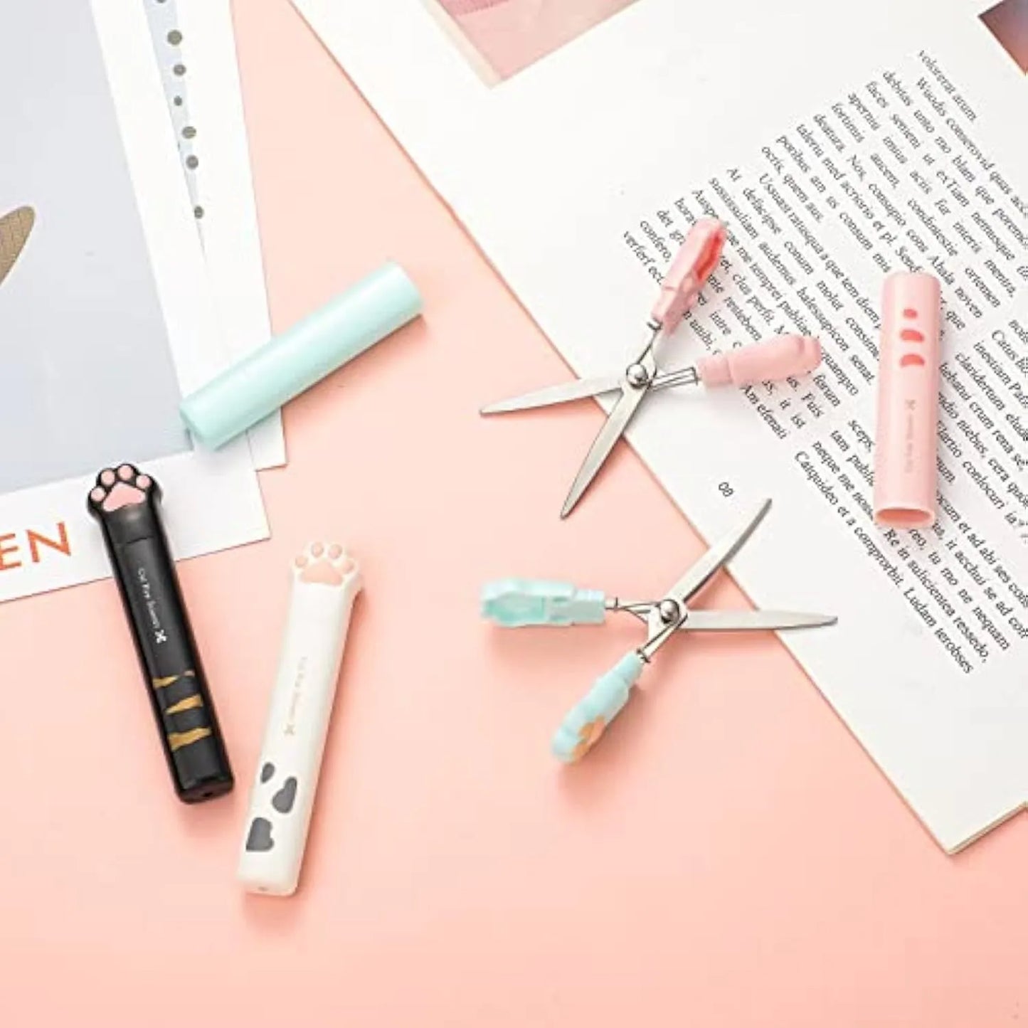 Closed cat paw design mini folding scissors showing safety lock, in choice of colours.