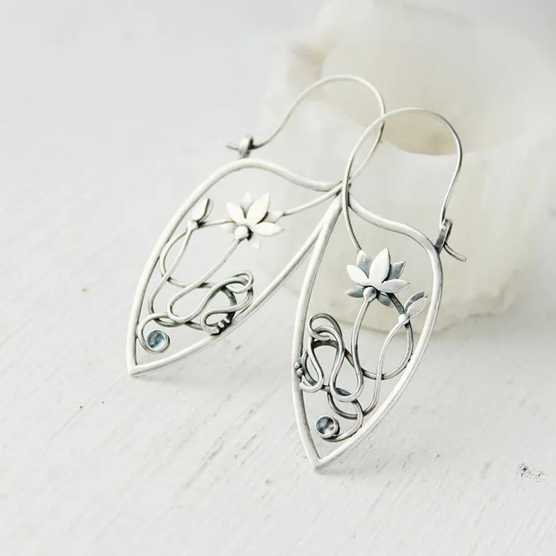 Silver lotus vine design women's earrings with geometric rhinestone details on electroplated alloy