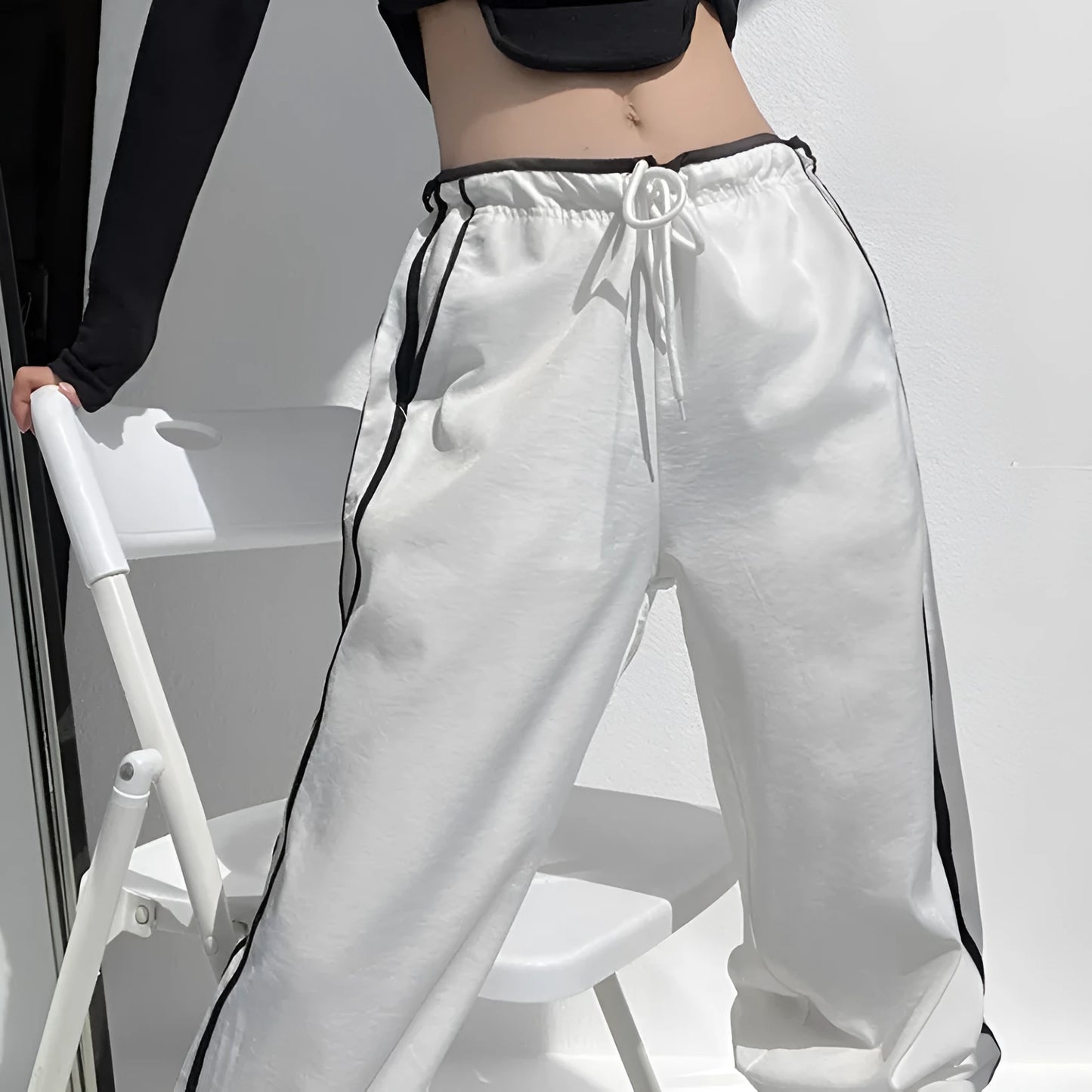 Women's navy blue straight-leg trousers with white contrast ribbon parallel bars pattern design