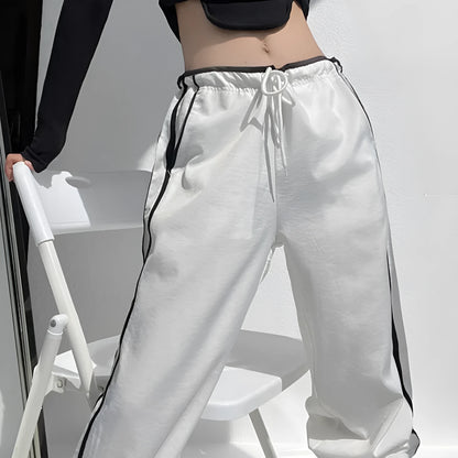 Women's navy blue straight-leg trousers with white contrast ribbon parallel bars pattern design