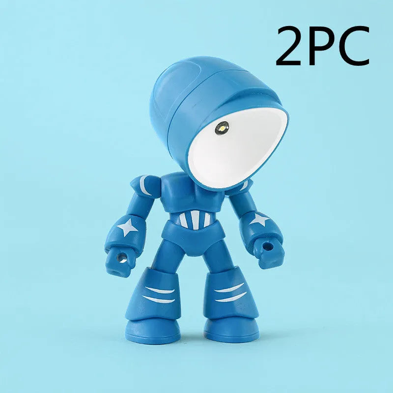 Mini mecha robot hero LED night light with adjustable arms on a desk.