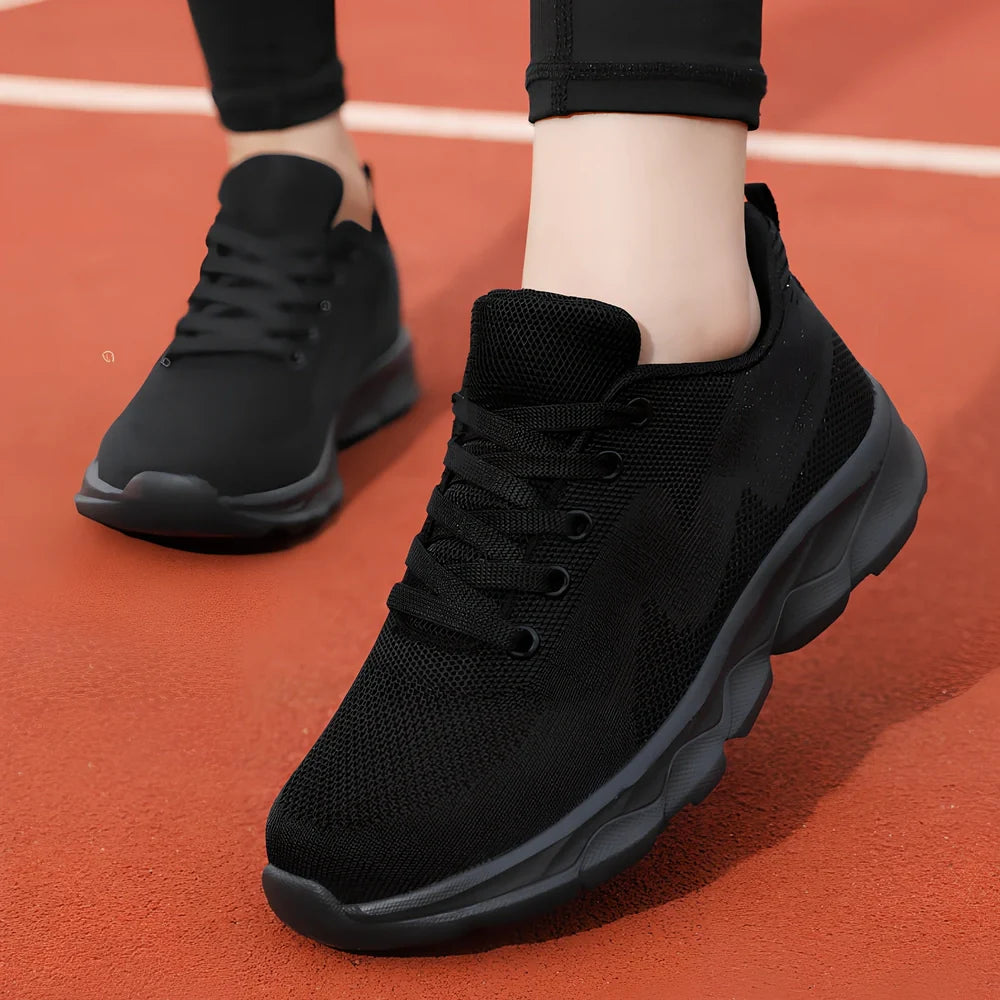 Women's black mesh running shoes with cross-strap and 3-5cm wedge heel, fabric upper with sewing details