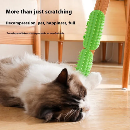 Silicone cat grooming comb with adjustable strap mounted on a table leg, shown in green.