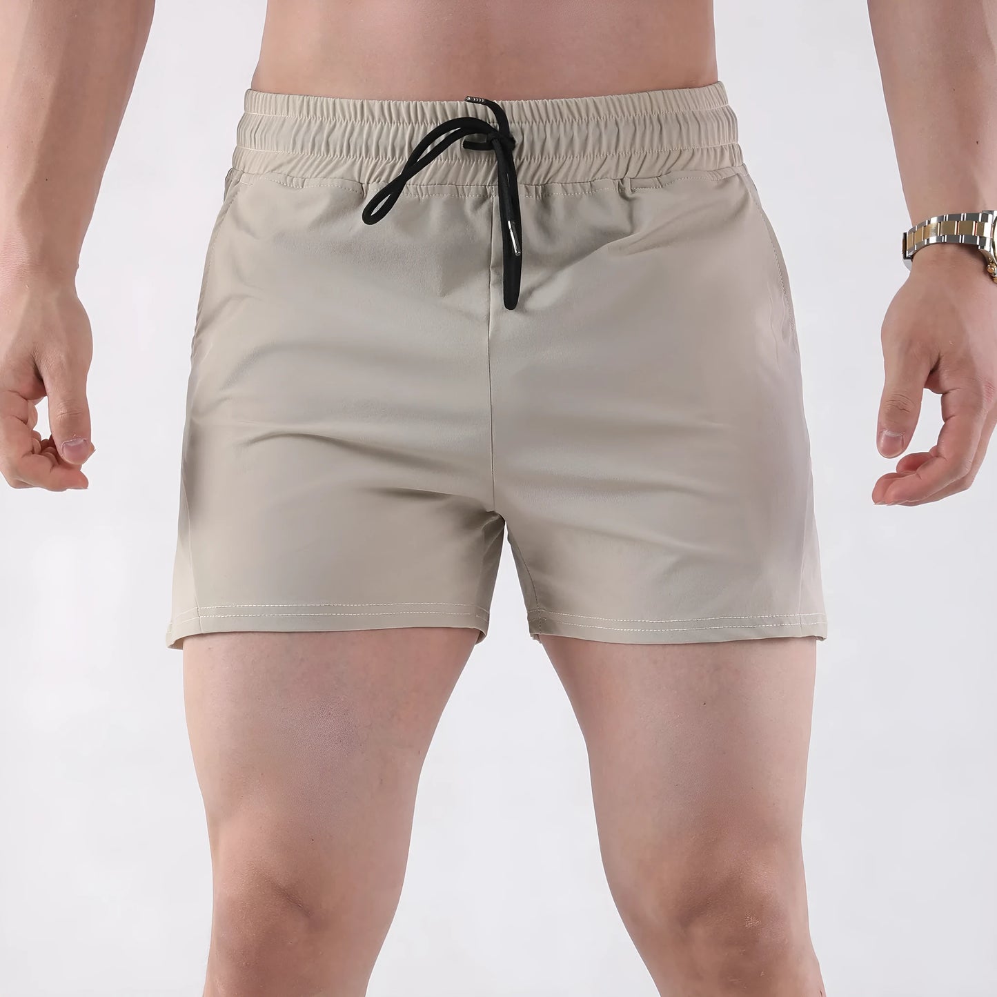 Men's thin grey polyester basketball shorts with an elastic waistband, shown laid flat.