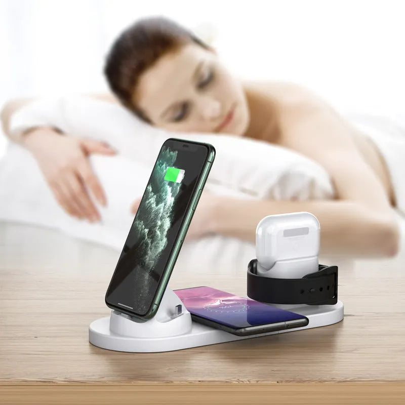 Black 6-in-1 wireless charging station with phone in holder, AirPods case, and smartwatch on charging spots.