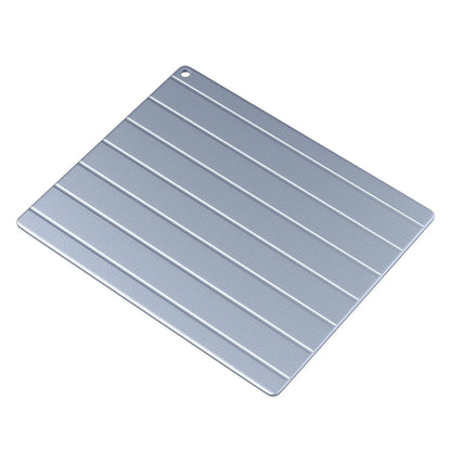 Aluminium household quick defrosting plate on a kitchen countertop