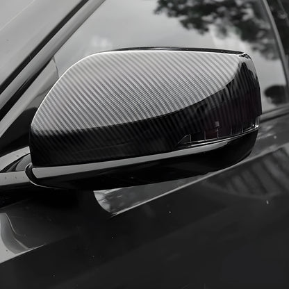 Pair of ABS plastic mirror covers for Cadillac CT5 CT6 in carbon fibre, silver, and rain frame finishes.