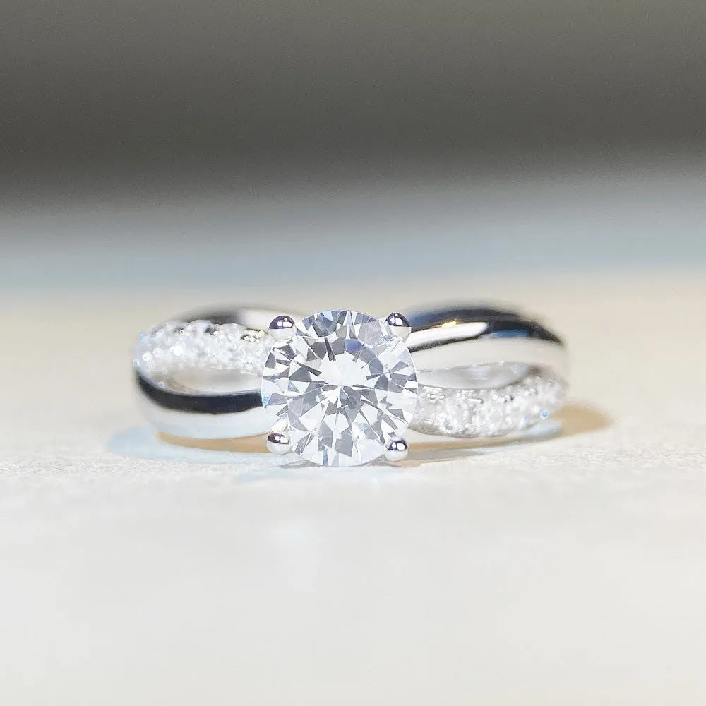 Geometric silver ring with winding twisted arm and 1 karat moissanite stone in four-claw setting