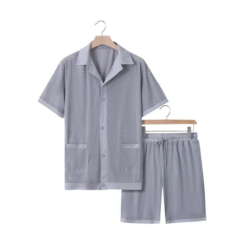 Light blue see-through beach shorts suit with matching cardigan on a summer background.