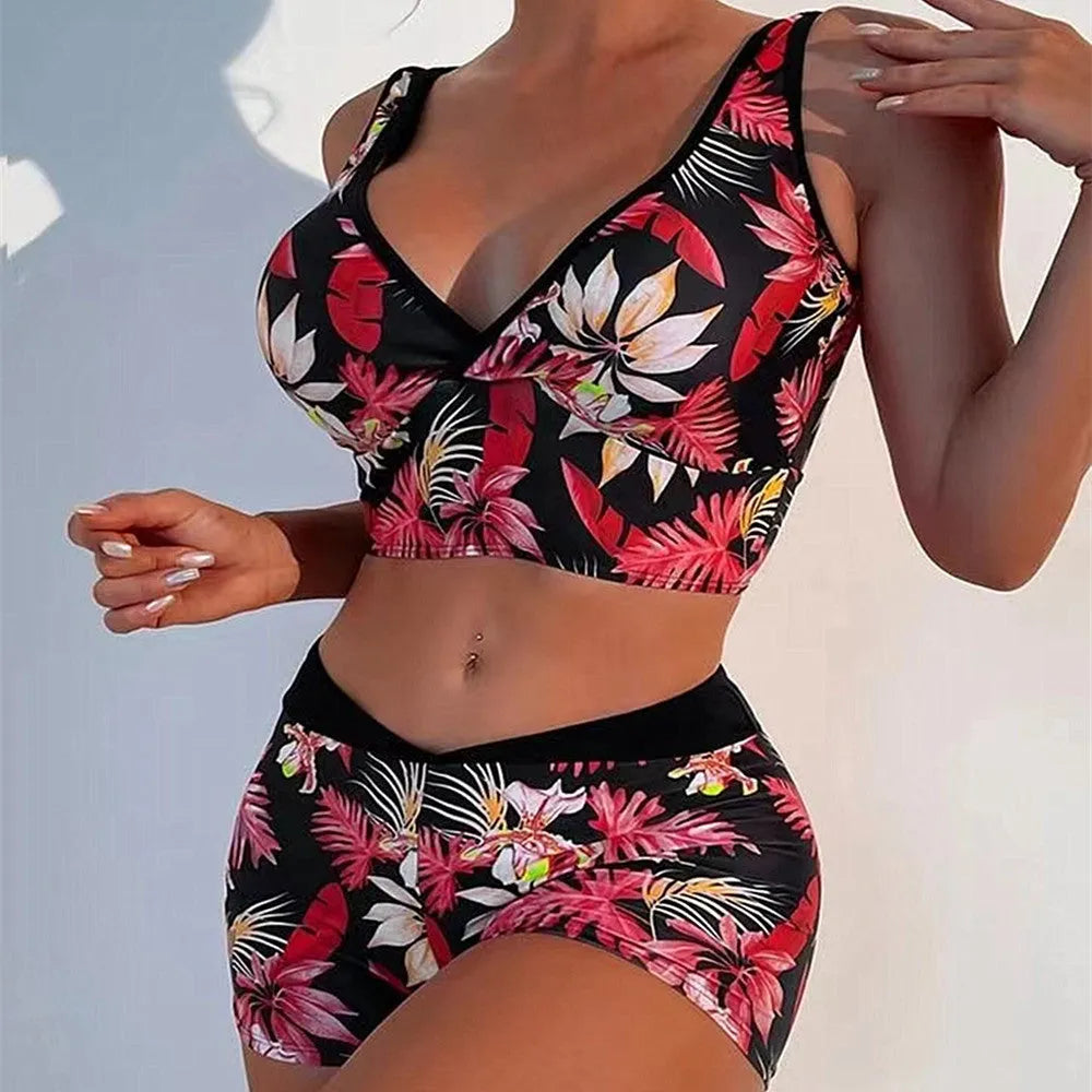 Women's two-piece swimsuit set showing sleeveless bikini top and printed boxer-style briefs in a multi-colour pattern.