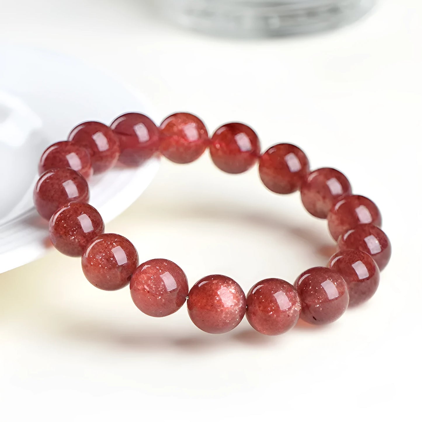 Natural strawberry quartz bracelet with geometric beads in starlight red colour.