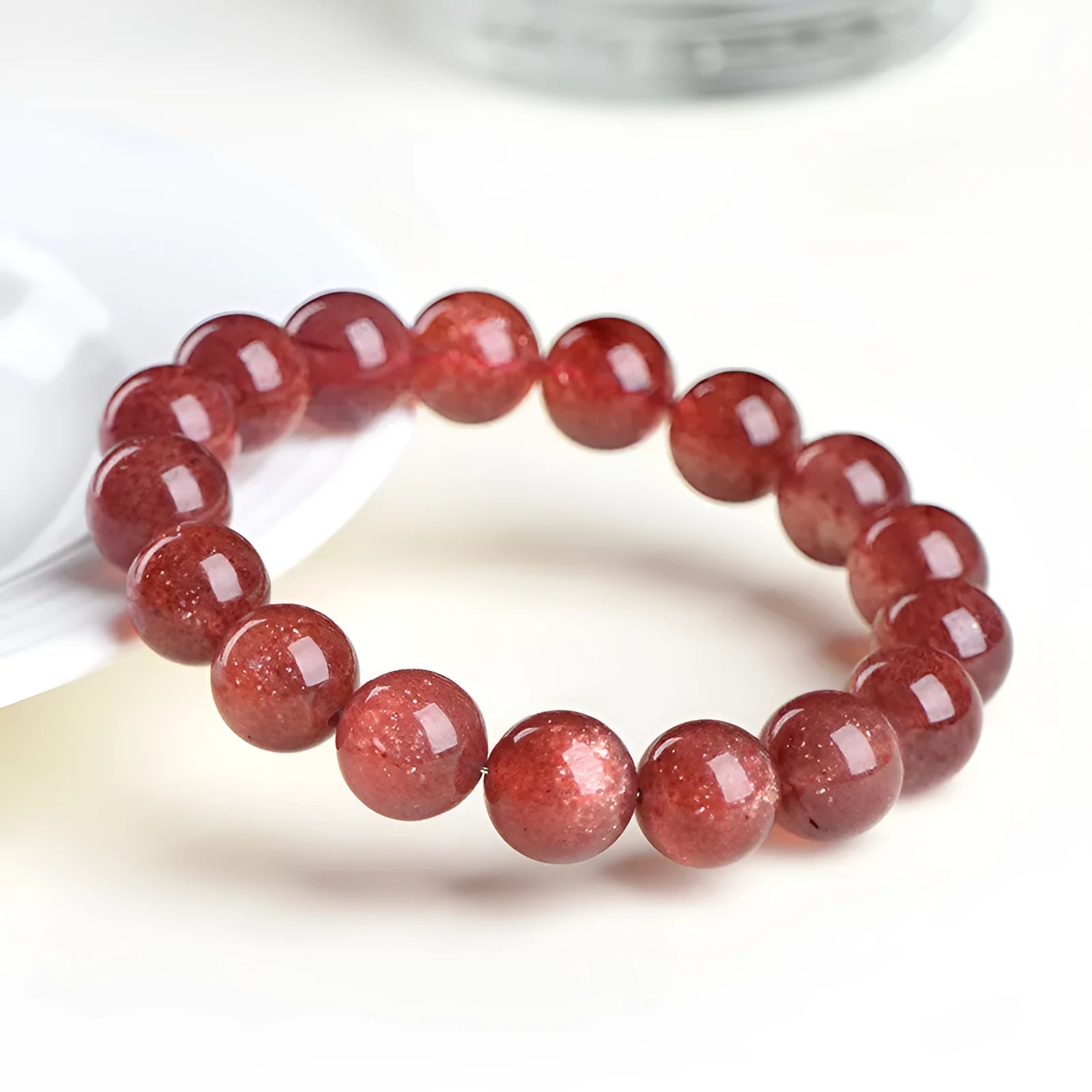 Natural strawberry quartz bracelet with geometric beads in starlight red colour.