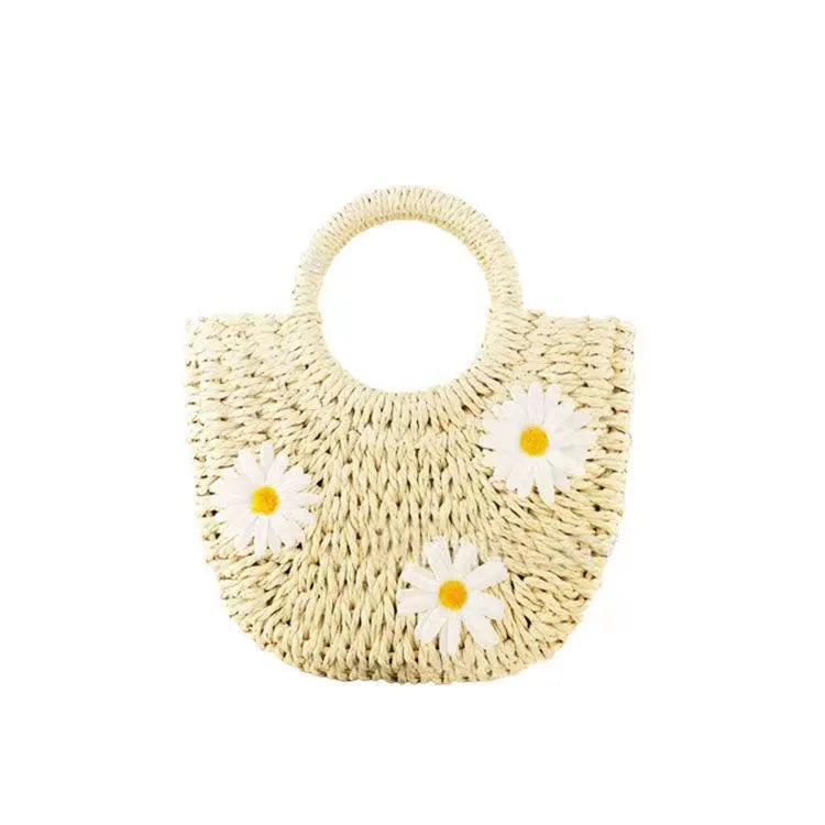 Women's light brown straw woven crossbody bag with daisy flower design showing 25x20x8 cm dimensions