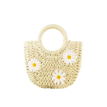 Women's light brown straw woven crossbody bag with daisy flower design showing 25x20x8 cm dimensions