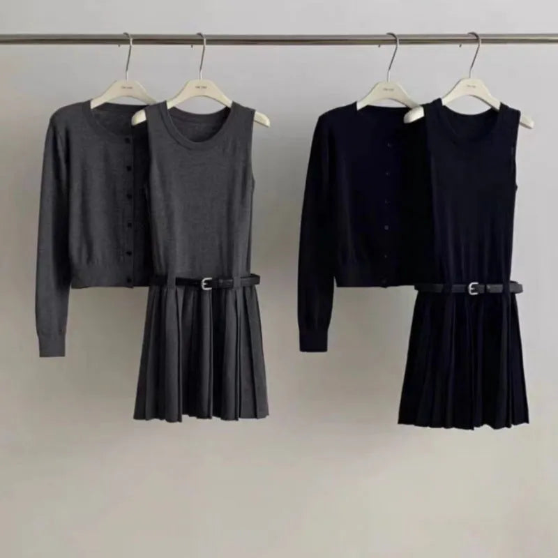 Women's grey knitted vest skirt and cardigan set with 3D pattern, adjustable belt, and pleating detail