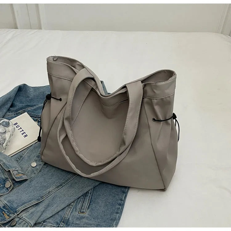 Soft Oxford cloth foldable commuter tote bag in street trend style, shown in available colours.