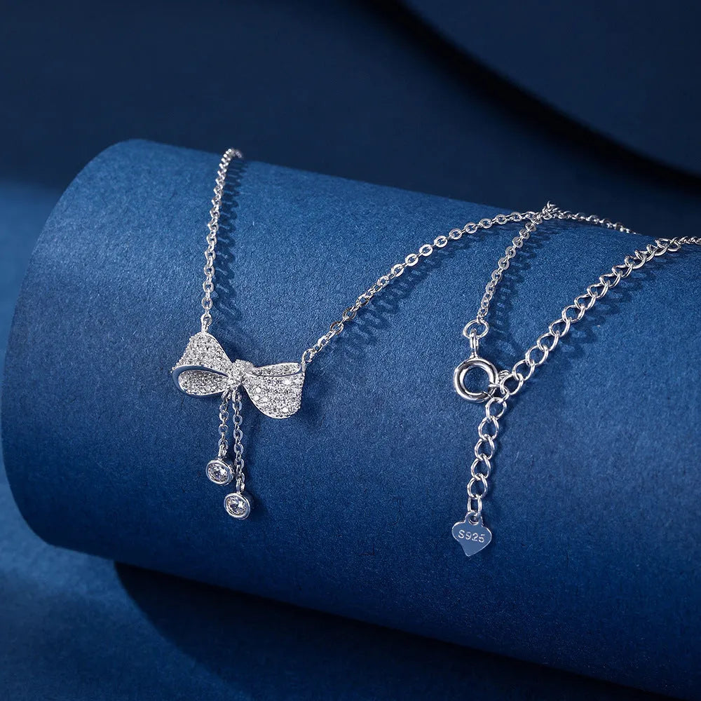 Silver bow pendant necklace with O-ring chain, adjustable 40-45cm length, 925 sterling silver composition