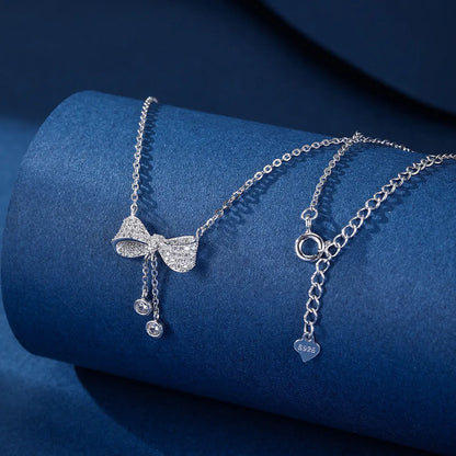 Silver bow pendant necklace with O-ring chain, adjustable 40-45cm length, 925 sterling silver composition