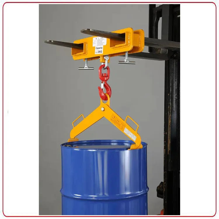 Heavy-duty iron forklift hook with rotatable drum and safety locking latch, shown mounted on forklift forks.