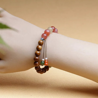 8mm diamond-shaped persimmon agate bracelet beads on wrist