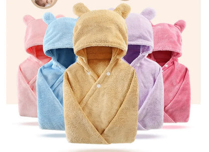 Blue hooded baby bath towel with dimensions 65cm by 110cm laid flat.