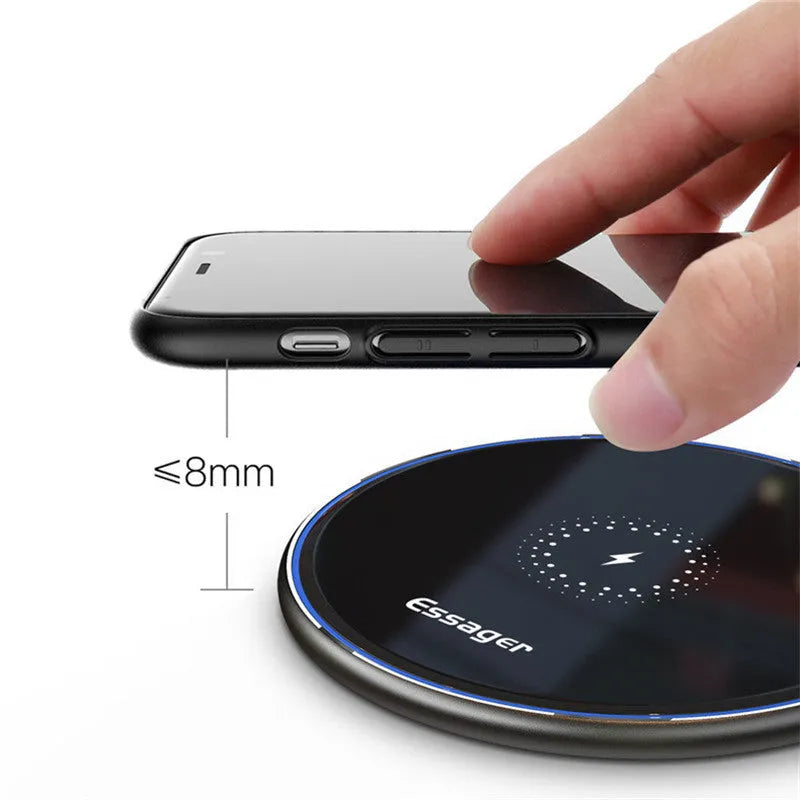 Black wireless charging pad with LED indicator light, measuring 10.1 by 7 centimetres
