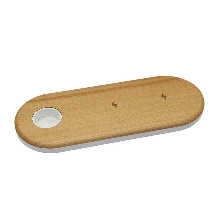 Ultra-thin bamboo and wood wireless charging stand for smartphones on a desk.