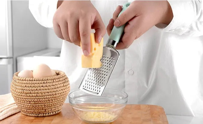 Nine-piece kitchen utensil set with stainless steel heads and plastic handles in four colour variations