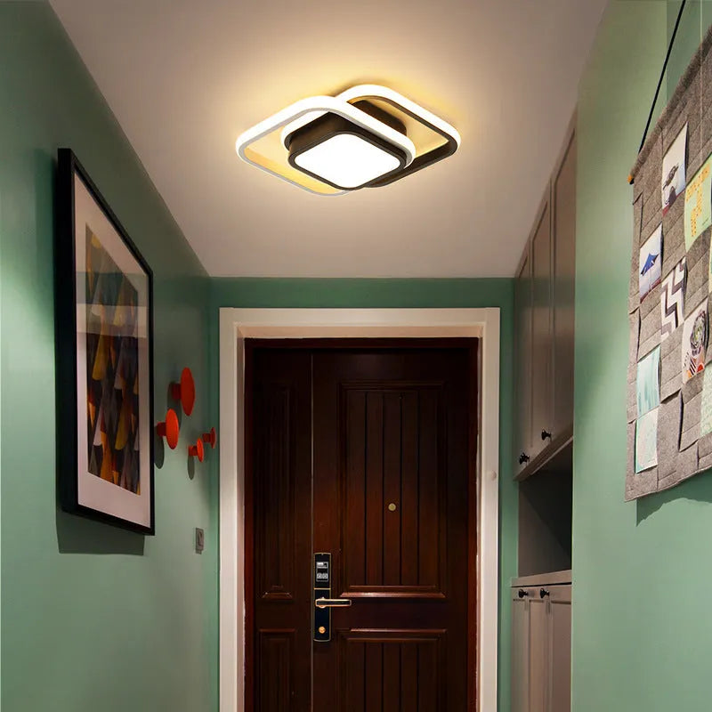 Modern geometric aluminium ceiling light in round and square styles with LED illumination.