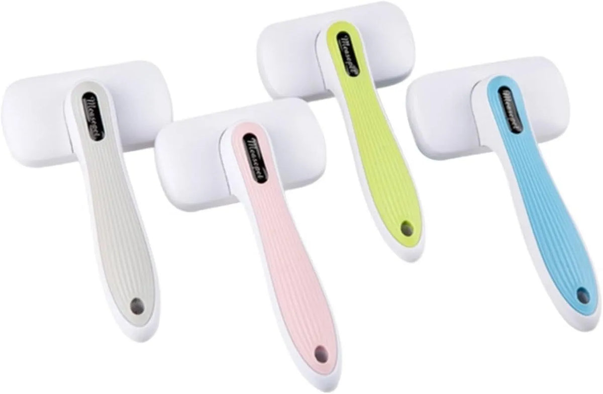 Blue automatic pet comb with one-click button for removing dog and cat hair on a table.