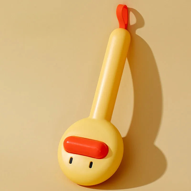 Small yellow duck-shaped plastic comb for grooming cats and dogs, with open needle teeth.