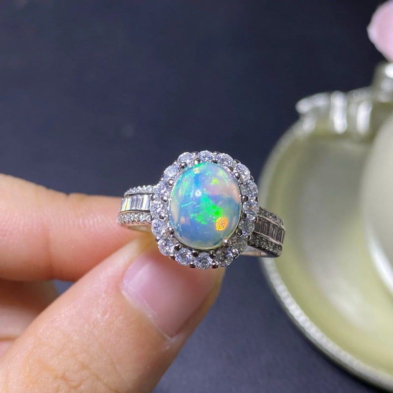 Opal ring handmade from silver in a natural style featuring a fully adjustable opening band for women, available in rose gold, yellow gold, and white gold plating colour options.