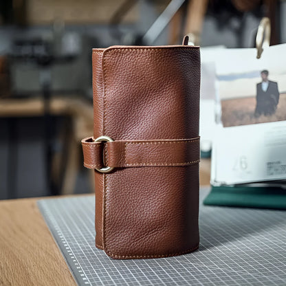 Handmade vintage leather wallet in black or dark brown with tape closure.