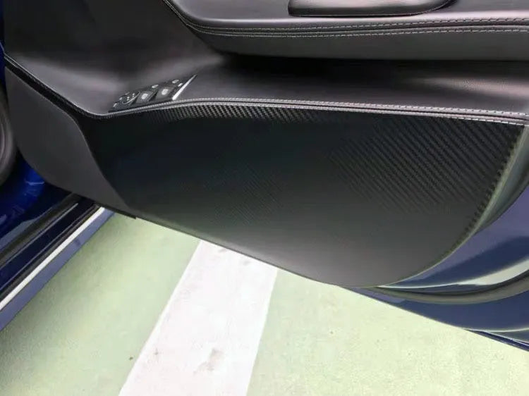 Carbon fibre protective film for Tesla Model S car doors showing four-piece set for front and rear door coverage