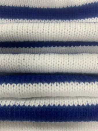 Sapphire blue striped knitted pullover sweater with round neck and long sleeves on a hanger.
