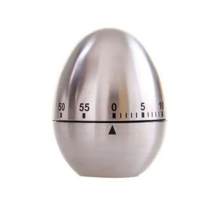 Stainless steel egg-shaped mechanical kitchen timer on a countertop.