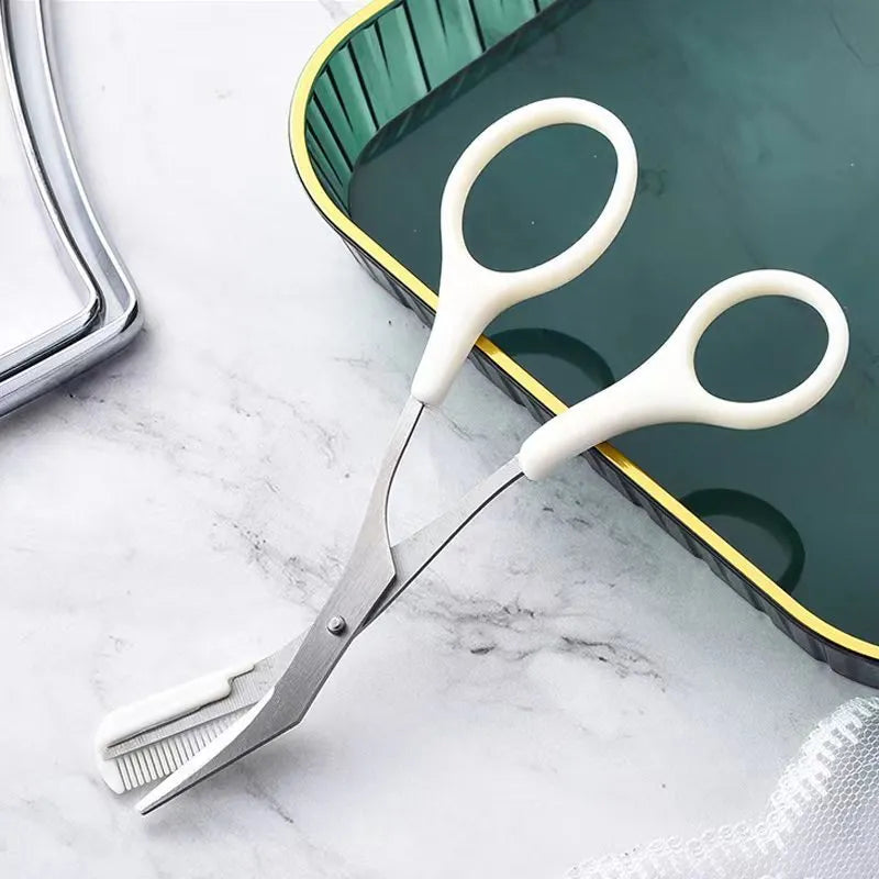 A curved moon-shaped eyebrow trimming knife and a cutting comb on a white background.