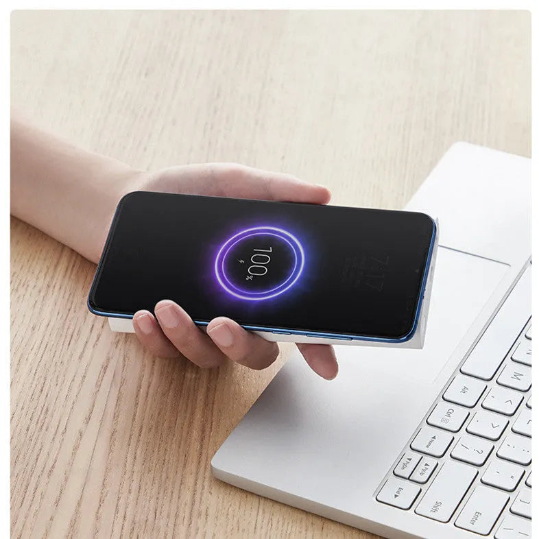 White or black 10000mAh power bank with USB Type-C input and wireless charging output