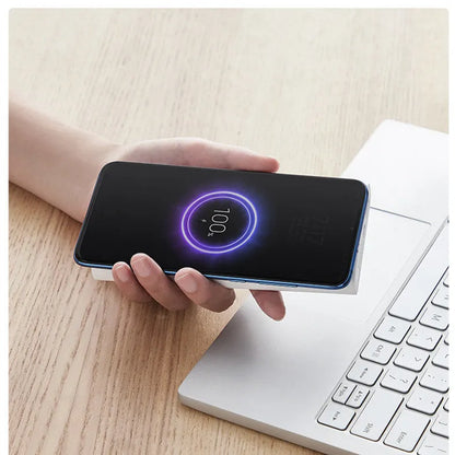 White or black 10000mAh power bank with USB Type-C input and wireless charging output