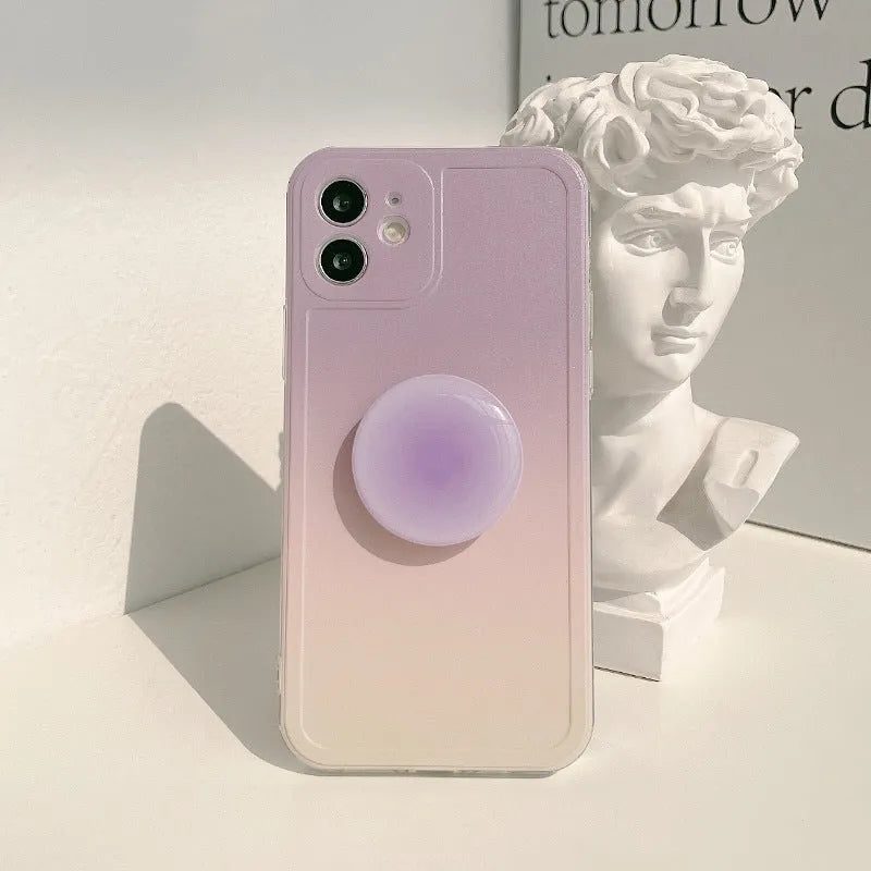 Yellow and purple gradient silicone iPhone case showing integrated airbag X bracket on the back.