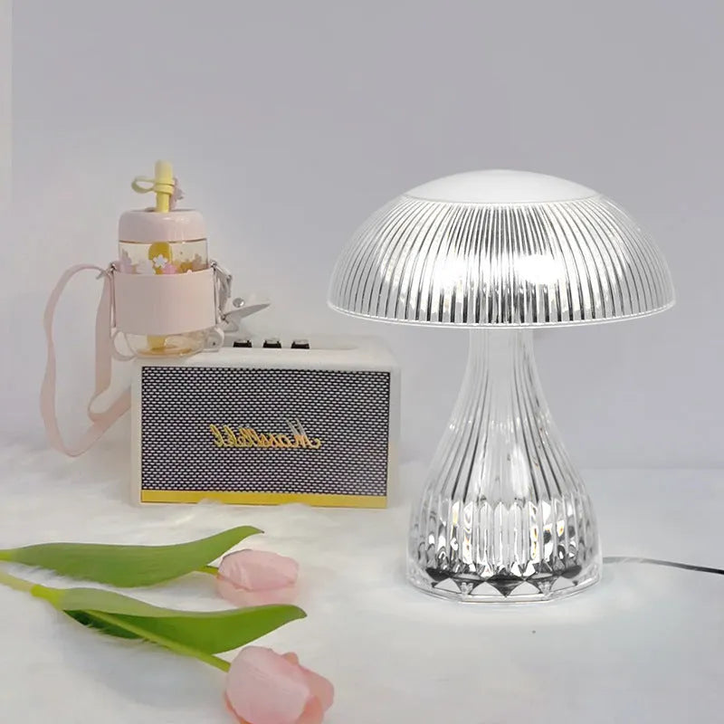 Small white acrylic USB rechargeable table lamp with a three-colour LED light.
