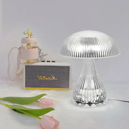 Small white acrylic USB rechargeable table lamp with a three-colour LED light.