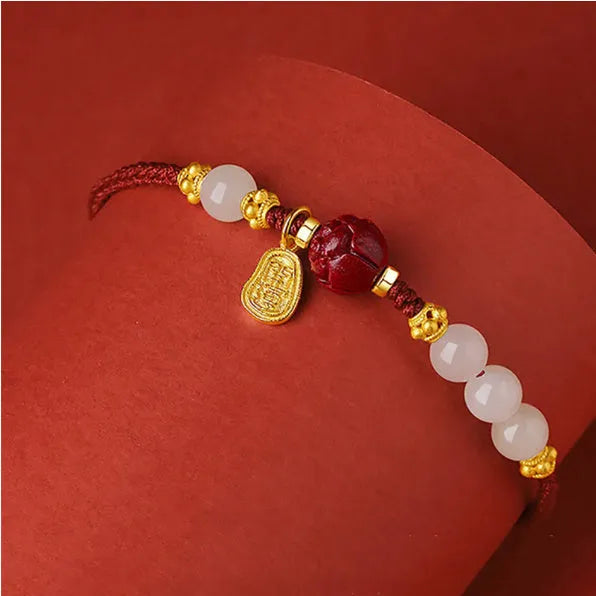 Women's bracelet made from Hetian jade and cinnabar red rope, featuring adjustable 925 silver chain length for personalised fit and advanced style suitable for gift-giving occasions and employee benefits.