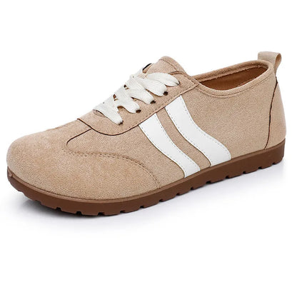 Women's vintage canvas sneakers in dark red with a round toe and flat rubber sole.