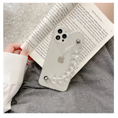 Transparent TPU iPhone case with love bracelet heart chain design on a mobile phone.