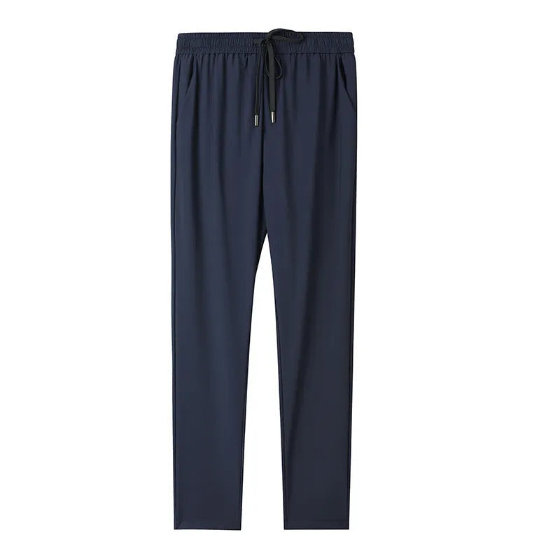 Grey hooded sun-protective top and loose pants suit for men on a hanger.