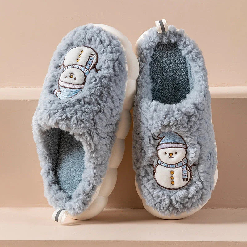 Cozy snowman-themed slippers with plush interior and thick, anti-slip soles for warm, comfortable indoor wear