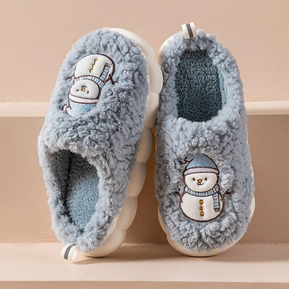 Cozy snowman-themed slippers with plush interior and thick, anti-slip soles for warm, comfortable indoor wear